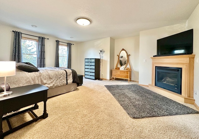 carpeted bedroom featuring a textured ceiling