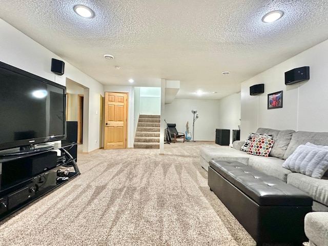 carpeted living room with a textured ceiling