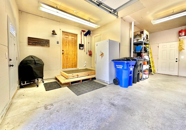 garage featuring white fridge