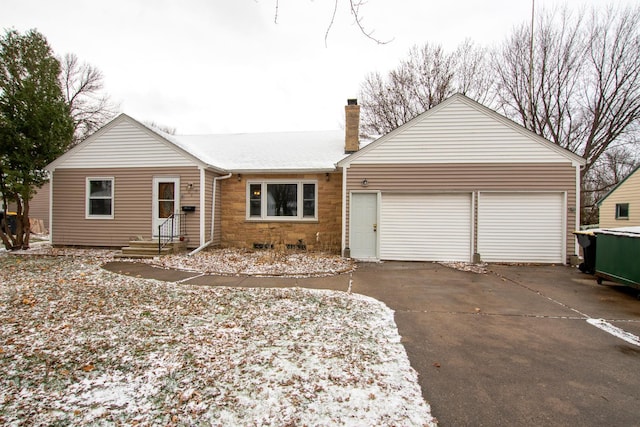 ranch-style home featuring a garage