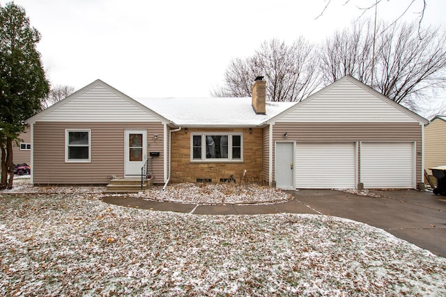 single story home featuring a garage