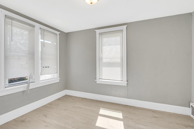 spare room with light wood-type flooring