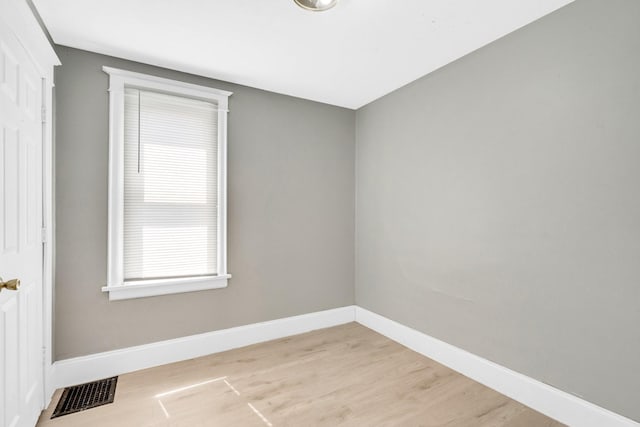 unfurnished room featuring light hardwood / wood-style flooring