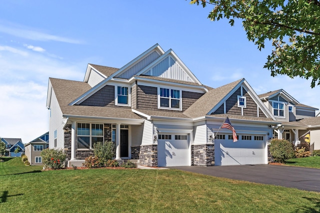 craftsman-style house featuring a front yard and a garage