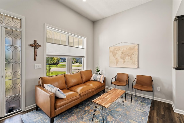 sitting room featuring a textured ceiling and dark wood-type flooring