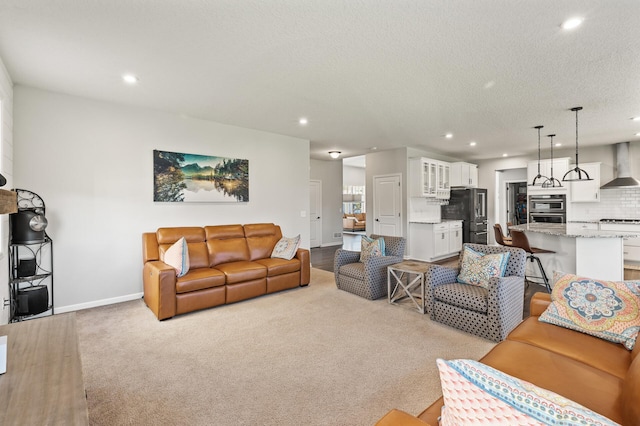 carpeted living room with a textured ceiling