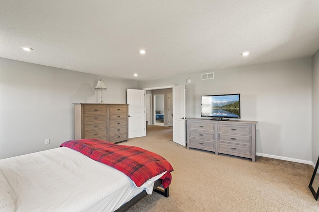 carpeted bedroom with a textured ceiling