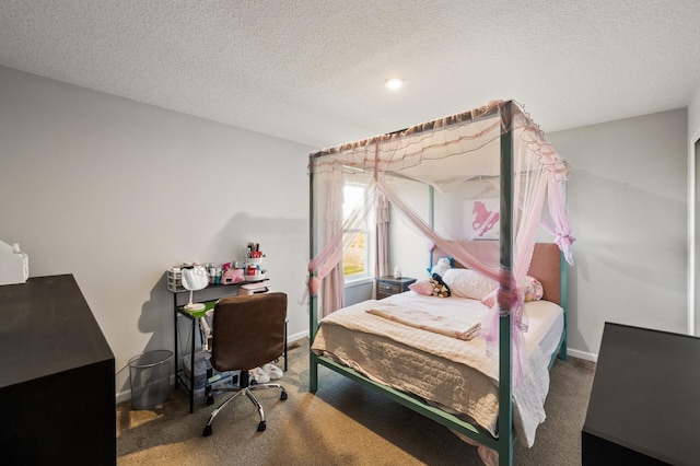 carpeted bedroom with a textured ceiling