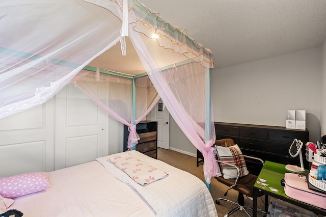 carpeted bedroom with lofted ceiling and a textured ceiling