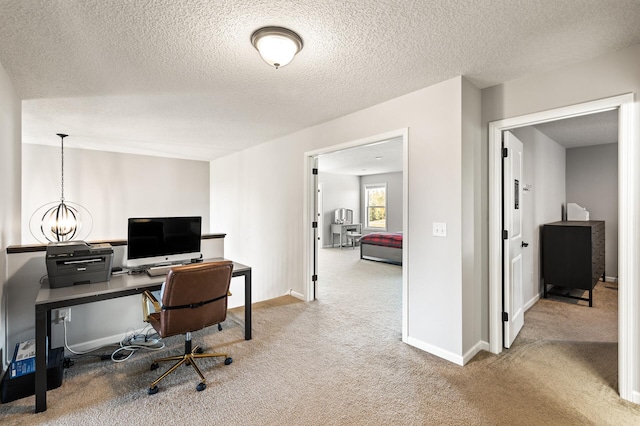 carpeted office with a textured ceiling and a notable chandelier