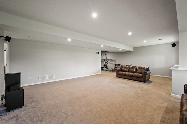 carpeted living room with a textured ceiling