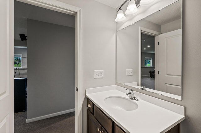 bathroom with vanity and a textured ceiling