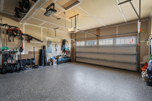 garage with electric panel and a garage door opener