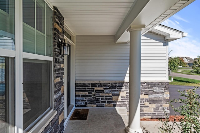 view of exterior entry with covered porch