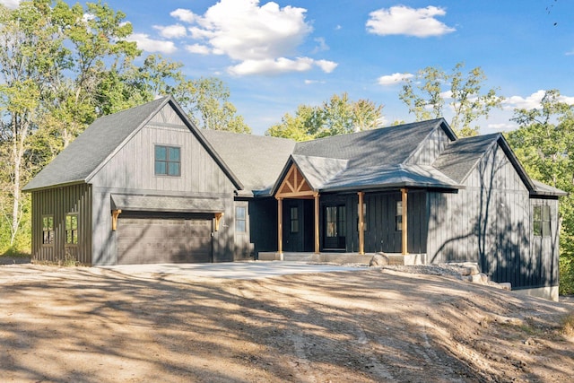 modern inspired farmhouse featuring a garage