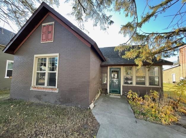 view of front of house with a sunroom