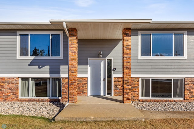 exterior space with brick siding