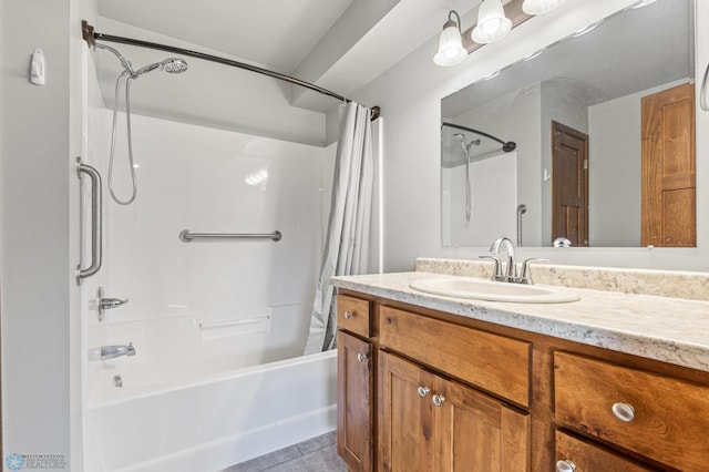 bathroom featuring tile patterned flooring, shower / bathtub combination with curtain, and vanity