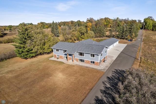 aerial view featuring a forest view