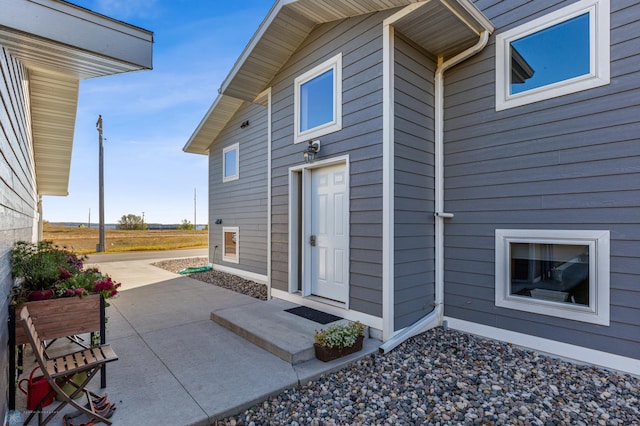 property entrance featuring a patio