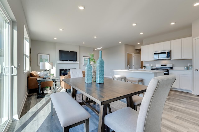 dining room featuring light hardwood / wood-style floors and sink