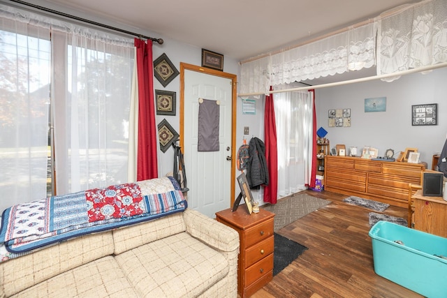 bedroom with dark wood-type flooring