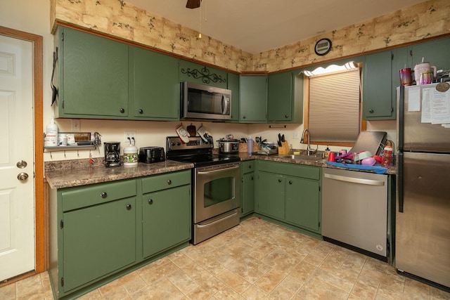 kitchen featuring sink, green cabinets, and stainless steel appliances