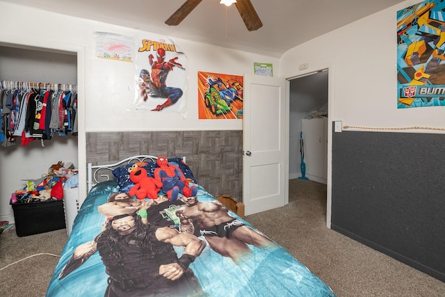 carpeted bedroom featuring ceiling fan and a closet