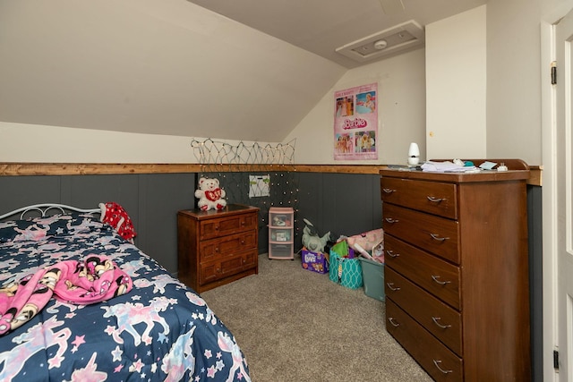 carpeted bedroom featuring vaulted ceiling