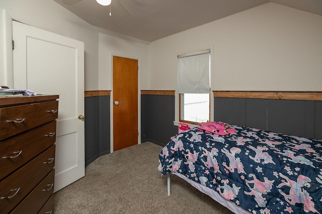 carpeted bedroom with ceiling fan and lofted ceiling