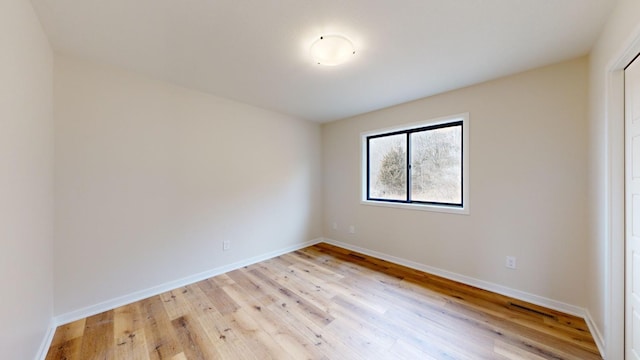 unfurnished room featuring light hardwood / wood-style flooring