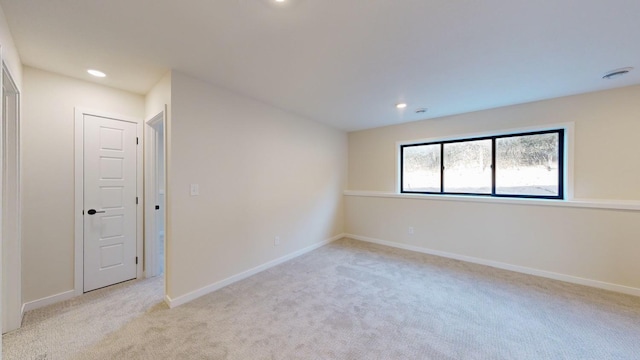 empty room featuring light carpet