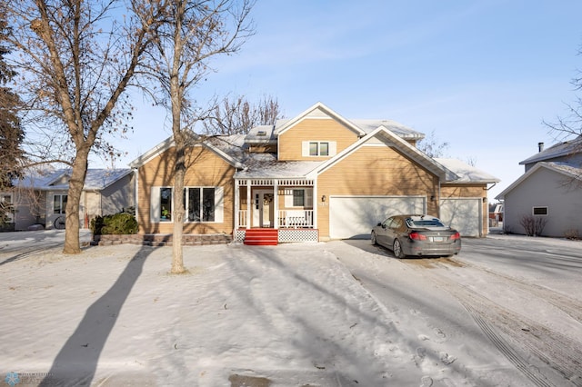 view of front of house with a porch and a garage