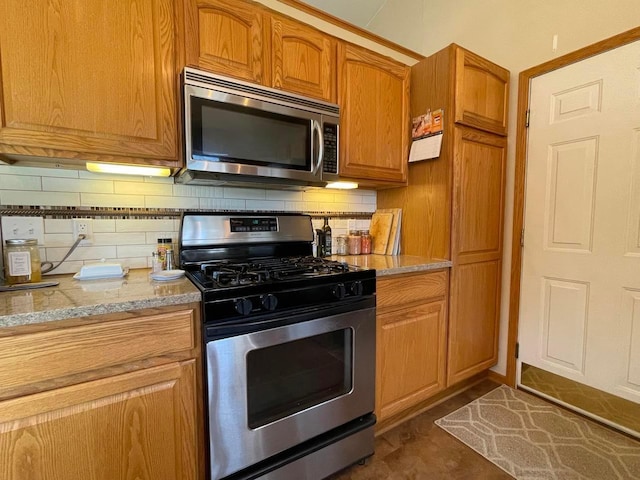 kitchen featuring decorative backsplash and stainless steel appliances