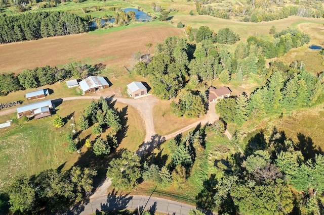 drone / aerial view featuring a rural view and a water view