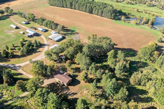 birds eye view of property with a rural view