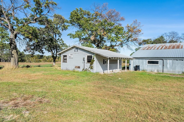 back of property with a lawn