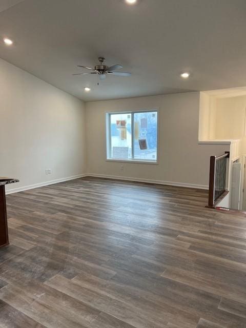 interior space with ceiling fan and dark wood-type flooring