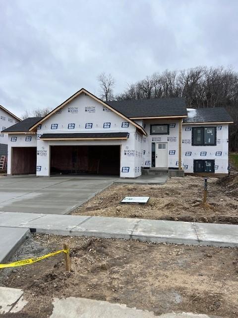 property in mid-construction with a garage