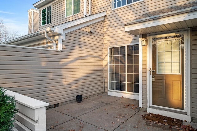 property entrance with a patio area