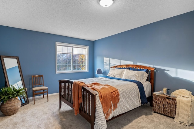 carpeted bedroom with a textured ceiling