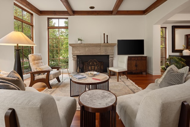 living room featuring hardwood / wood-style flooring and beam ceiling