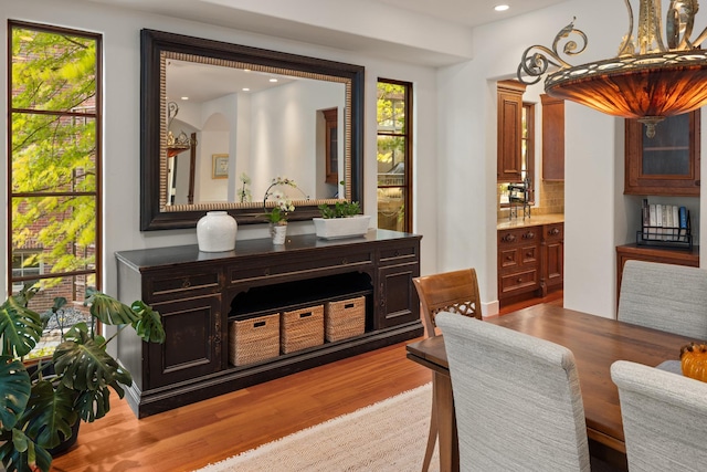 interior space featuring light hardwood / wood-style flooring and tasteful backsplash