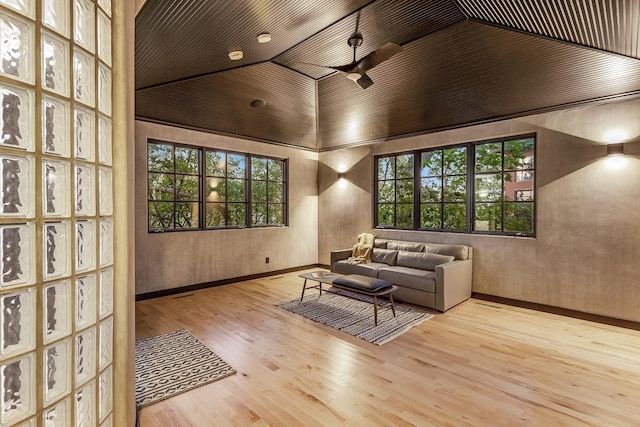 interior space featuring light hardwood / wood-style floors, wood ceiling, and high vaulted ceiling