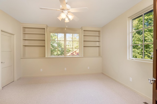 unfurnished bedroom featuring ceiling fan and carpet