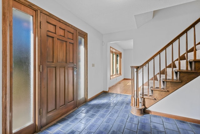 foyer entrance with dark wood-type flooring