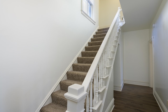 stairs with wood-type flooring