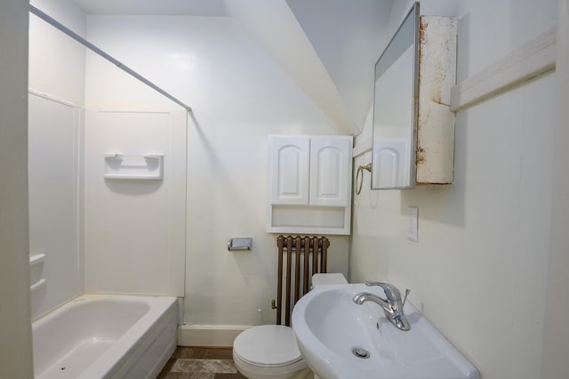 full bathroom featuring toilet, sink, radiator, and bathing tub / shower combination