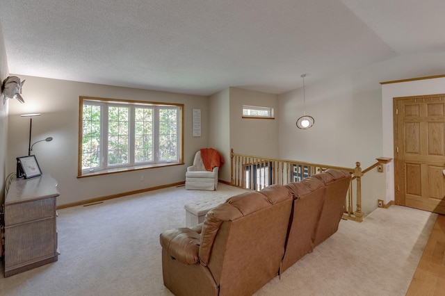 living room with lofted ceiling, light wood-type flooring, and a textured ceiling