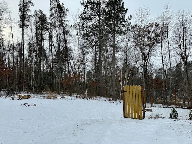 view of yard layered in snow